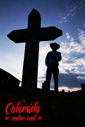 Silhouette of a Grave Marker and Cowboy